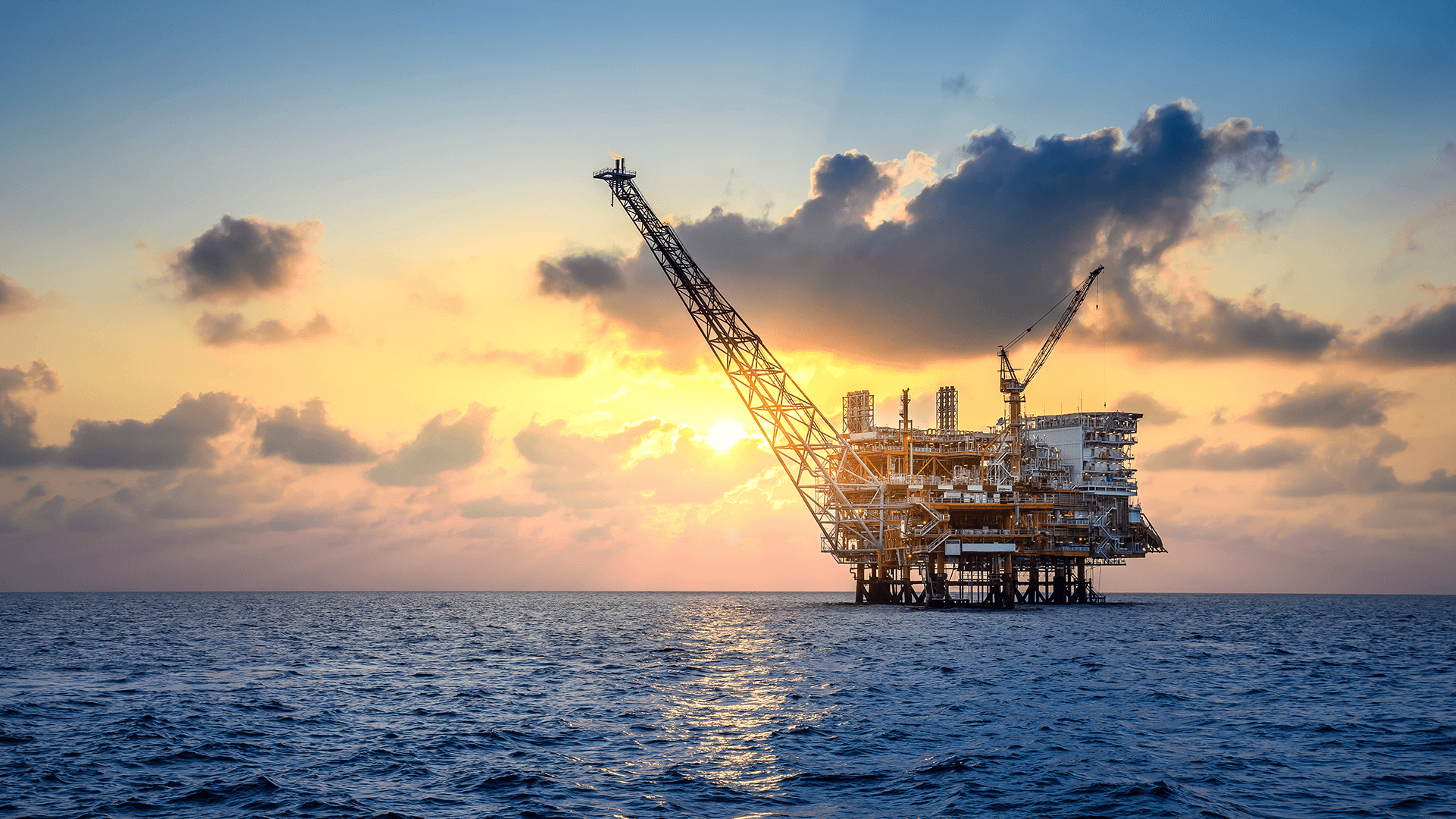 Offshore oil and rig platform in sunset or sunrise time